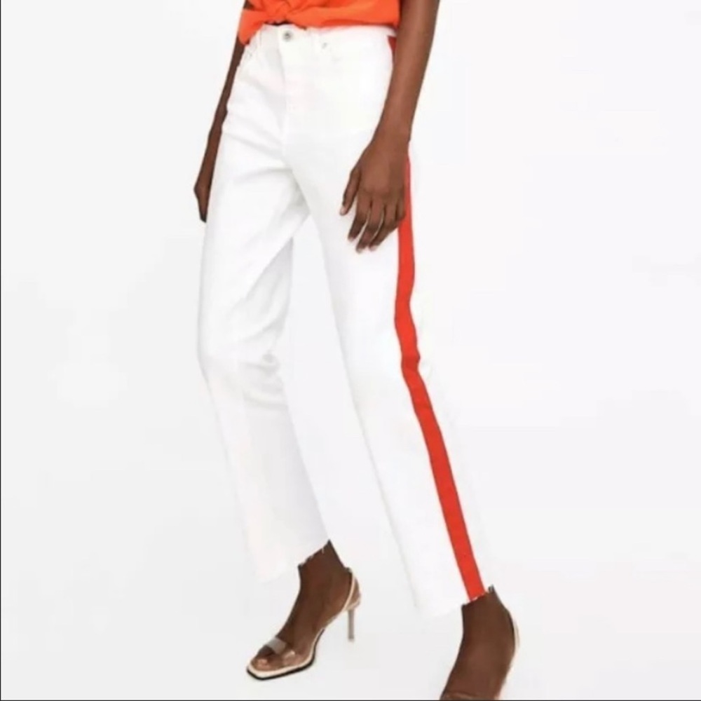 White denim jeans with a red vertical stripe
